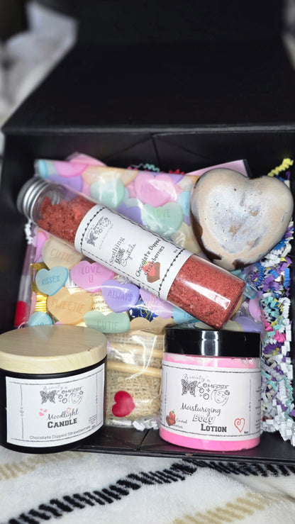 Assorted self-care products including a candle, lotion, and bath salts on a textured surface.